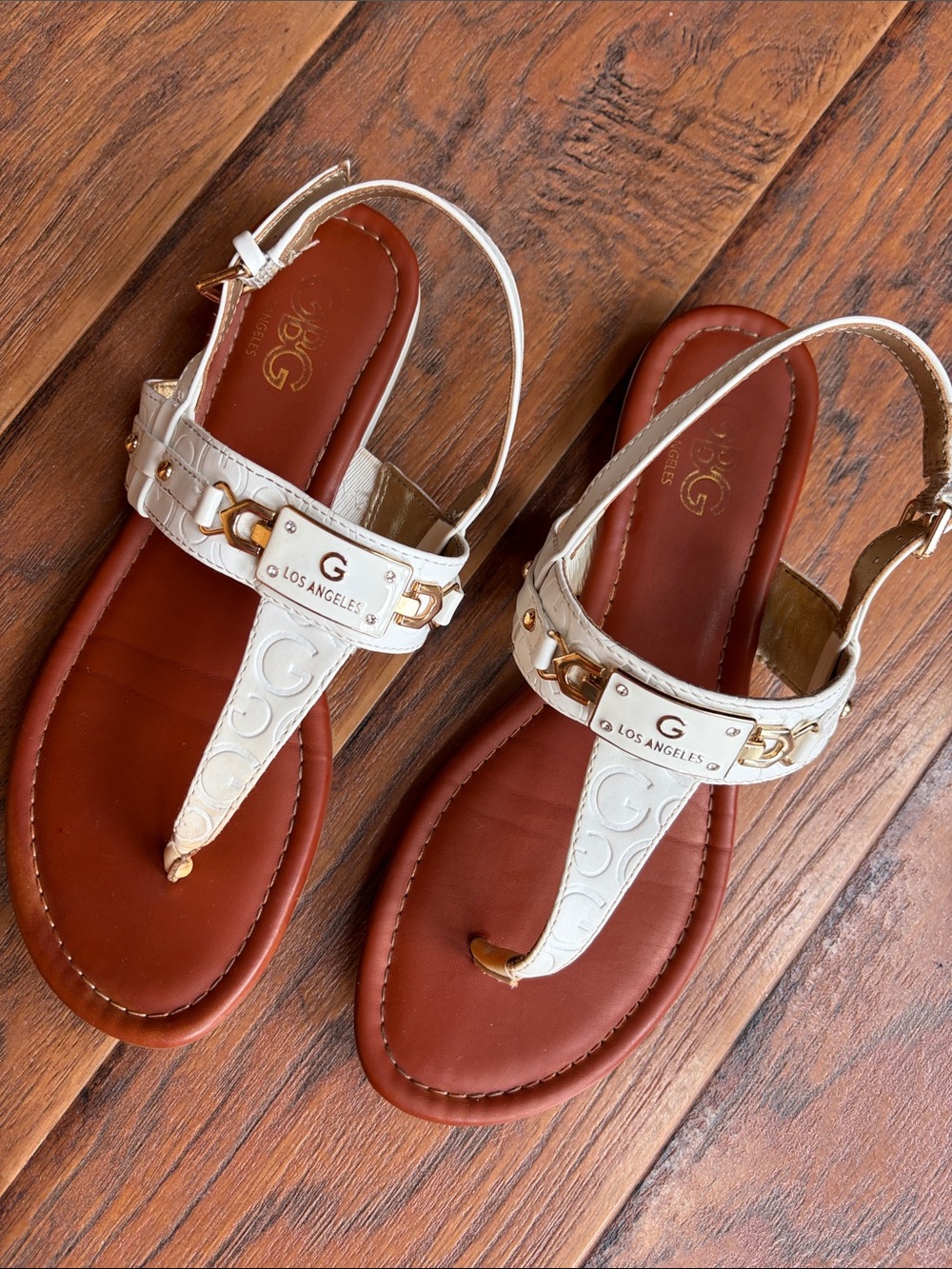 G by Guess White Logo-Embossed T-Strap Sandals with Gold Accents - Size 8